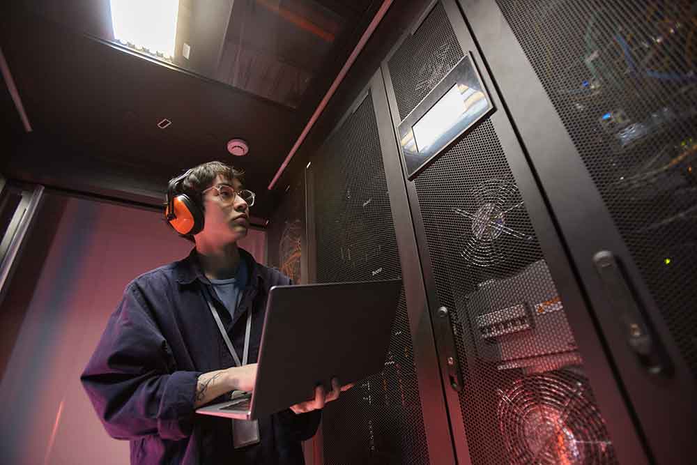 Middle aged data scientist checking servers